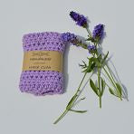 Lilac banded, crocheted, cotton washcloth with 3 sprigs of actual lavender flowers