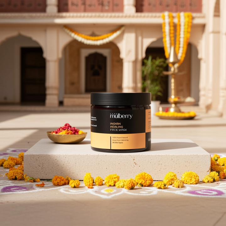 Mulberry powder face mask product jar with flowers on a decorative platform in front of an architectural background